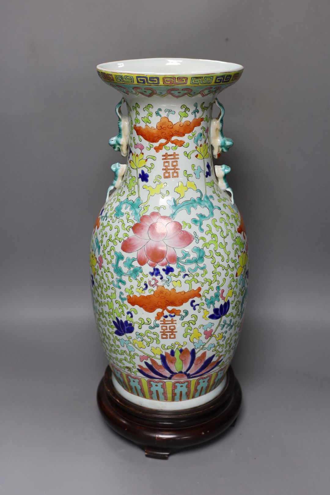 A large Chinese enamelled porcelain vase, on wood stand 53cm